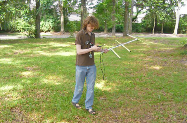 A youth tries out his new fox-hunting antenna...